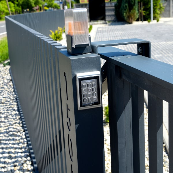 Sliding gate with automatic house number and digital key.